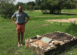 Dickie next to his namesakes grave, Frederick Courteney Selous, Selous Game Reserve, Tanzania