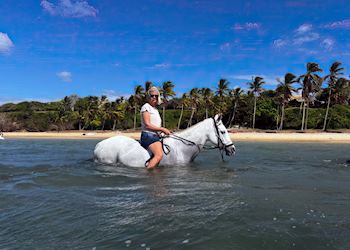 Jackie horse riding in the Indian Ocean