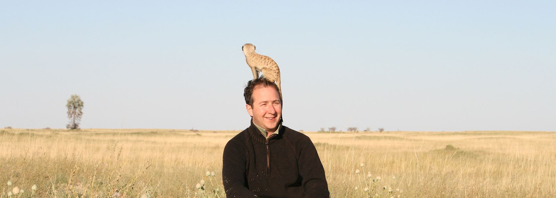 James shows off his new meerkat hat, Botswana