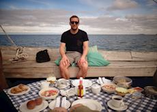 Russell enjoying lunch by the shore of Lake Malawi