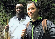 Toby with his guide in Uganda
