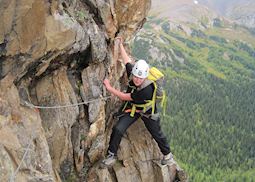 Anna climbing a via ferrata in the Rocky Mountains, Canada