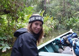 Stella taking a boat trip in the Amazon, Peru