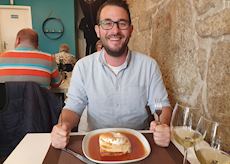 Rob trying the local cuisine in Porto, Portugal