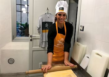 Samantha taking a cooking class in Bologna