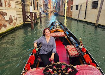 Sarah taking a gondola ride in Venice