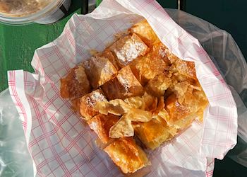 Tess enjoying bougatsa in Litochoro, Greece