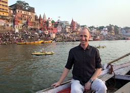 Nick floating down the Ganges in Varanasi, India