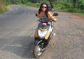 Sophie trying a local scooter, India