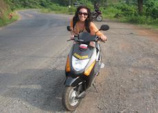 Sophie trying a local scooter, India