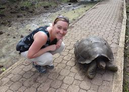 Caroline with a giant tortoise in the Galapagos Islands