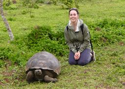 Catherine with a giant tortoise on Santa Cruz Island, Galapagos