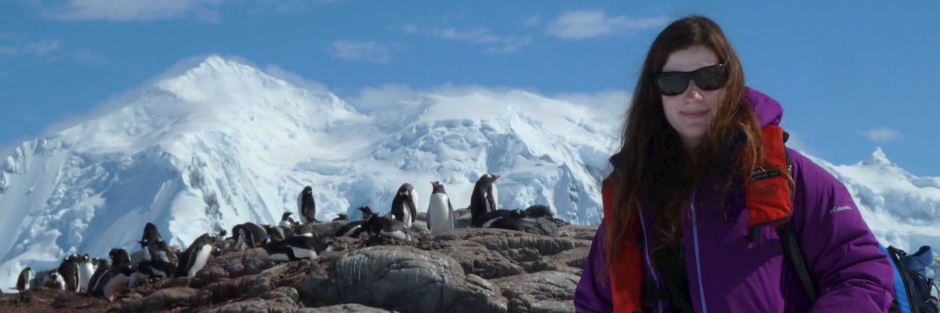 Lizzie with penguins in Antarctica
