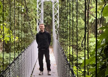 Spencer on a bridge in the cloud forest