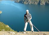 Tom abseiling over Lake Nahuel Huapi, Bariloche, Argentina