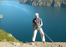 Tom abseiling over Lake Nahuel Huapi, Bariloche, Argentina