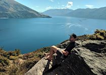 Colin hiking on Mou Waho, looking over Lake Wanaka