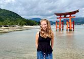 Amy in front of the Torii Gate in Hiroshima, Japan