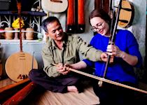 Chloe learning about traditional music in Hanoi, Vietnam