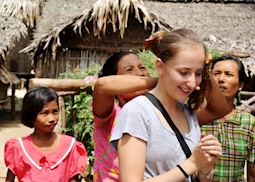 Hannah having her hair wrapped in a Burmese Bun, Pagan, Myanmar