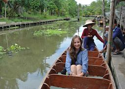 Hannah on a boat ride around the floating market in Amphawa, Thailand