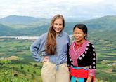 Hannah and a local guide with views out across the Mekong River in Chiang Khong, Northern Thailand