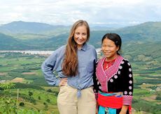 Hannah and a local guide with views out across the Mekong River in Chiang Khong, Northern Thailand