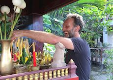 Mark making an offering in Cambodia