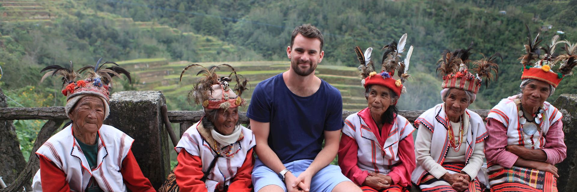 Mat with the local rice farmers in their traditional dress, Banaue, Philippines