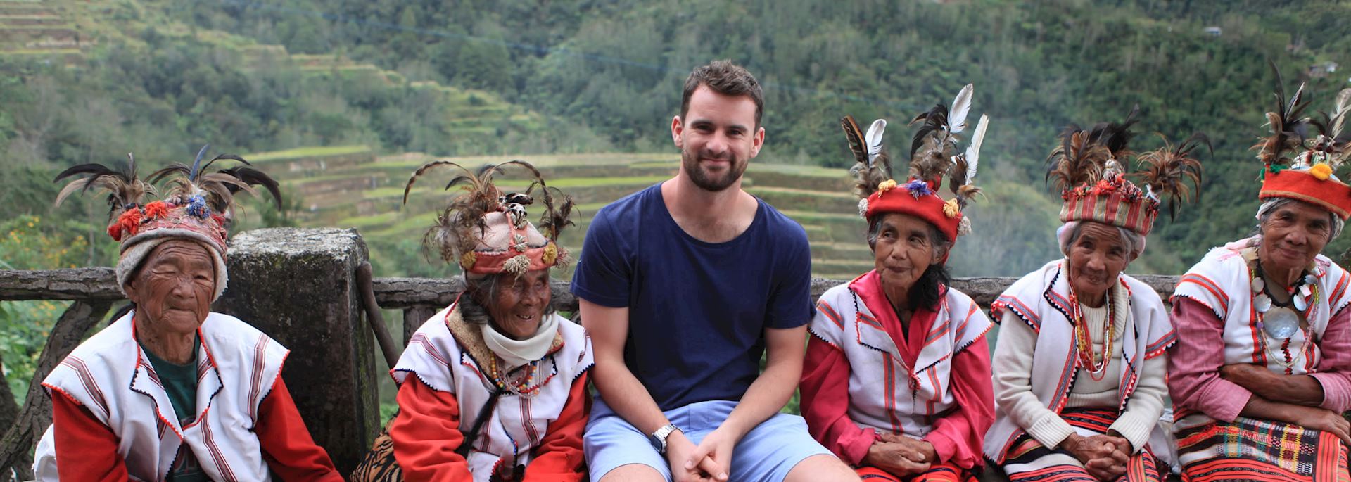 Mat with the local rice farmers in their traditional dress, Banaue, Philippines