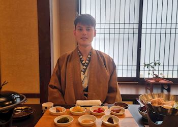 Remi eating kaiseki in a ryokan, Japan