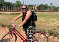 Sophie cycling in Sukhothai, Thailand