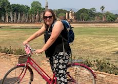 Sophie cycling in Sukhothai, Thailand