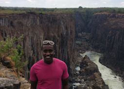 David standing at the edge of Victoria Falls