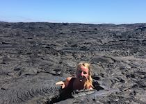 Hannah hiding in the lava in the Galapagos