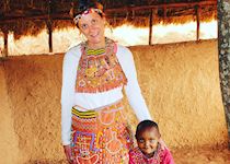 Katie wearing a tribal wedding dress in Tloma Village in Tanzania