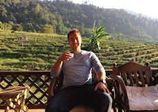 Matt sampling the local tea at a tea plantation in Chiang Rai, Thailand