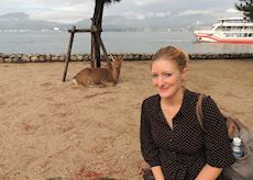 Posing with a deer in Miyajima