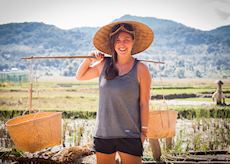 Veronica carrying rice in Luang Prabang