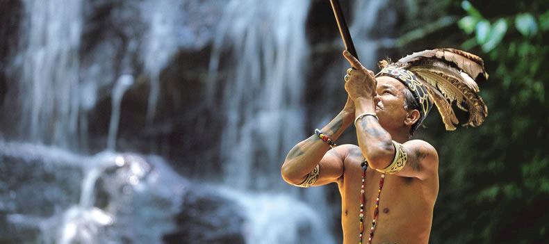 Tribesman with blowpipe, Batang Ai, Sarawak
