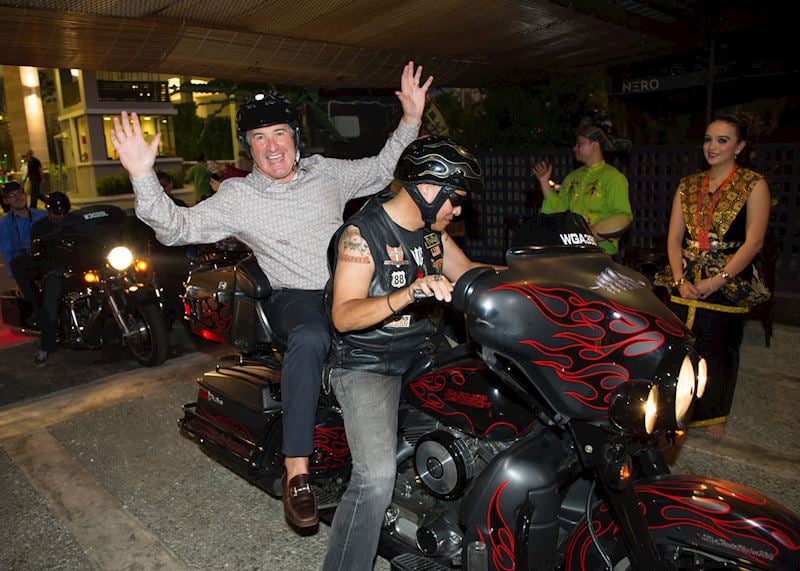 Audley's chairman arrives at the Guide Awards in Kuala Lumpur on the back of a Harley Davison