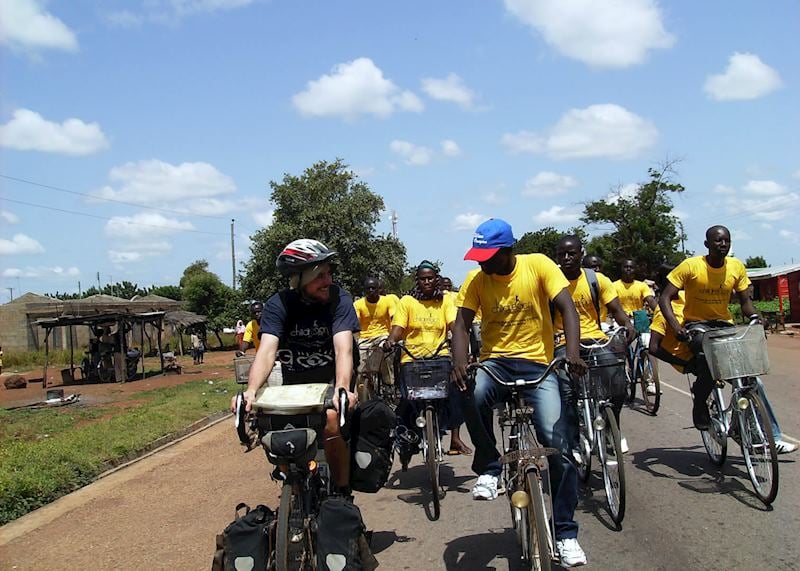 Ian and volunteers with the charity ChildReach international, cycling through Tamale in Ghana