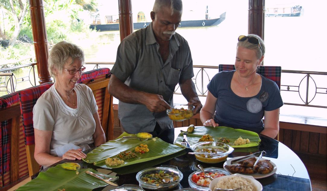 Captain Shaji serving dinner on the rice boat